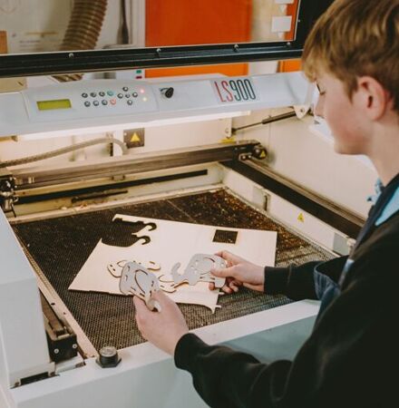 Whitecross Hereford High School - Resistant Materials student and laser cutter